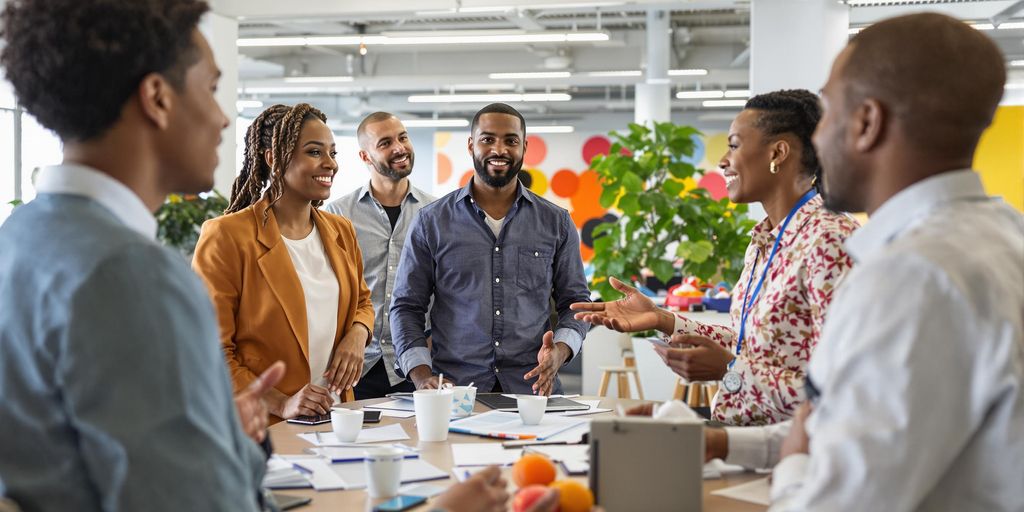 Diverse group of leaders collaborating in a bright workspace.