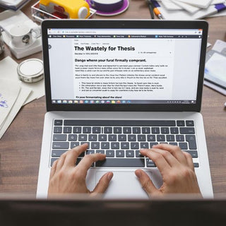 Person typing on a laptop with notes and coffee.