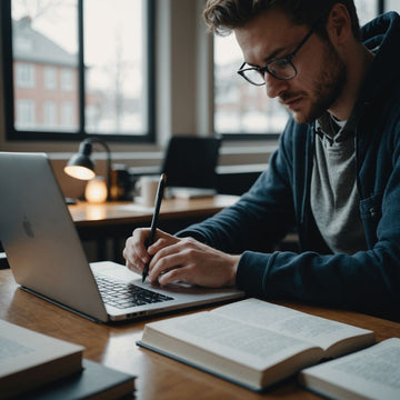 Student writing research proposal with books and laptop