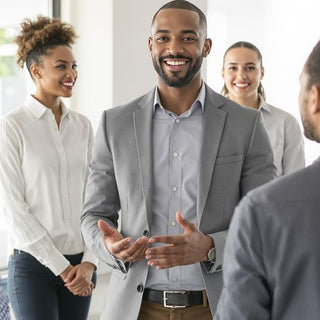 Diverse team collaborating under inspirational leadership in office.