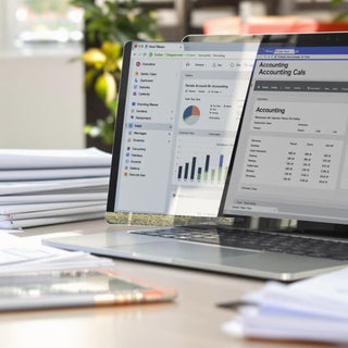 Desk with calculator and financial documents for accounting.