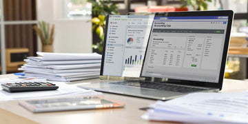 Desk with calculator and financial documents for accounting.